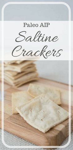 some crackers sitting on top of a cutting board with the words pale aip saldine crackers