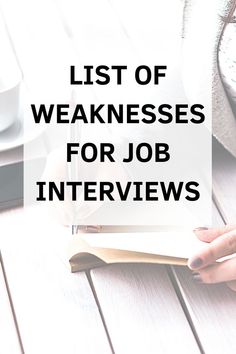 the words list of weaknesses for job interviews on top of a wooden table