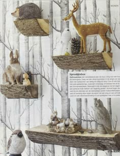 an image of birds and animals on display in the woods with deers, owls, pine cones