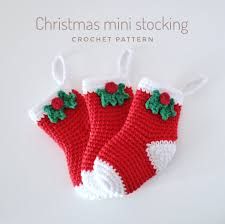 two crocheted christmas stockings hanging on a white background with the words christmas mini stocking written below them