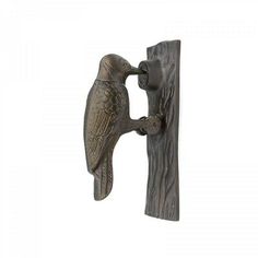 an image of a bird on a door handle