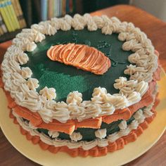 there is a cake that looks like noodles and carrots on the top of it