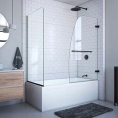 a white tiled bathroom with a walk in shower