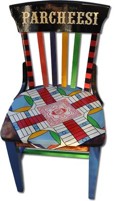 a colorful wooden chair with the word parchesi painted on it