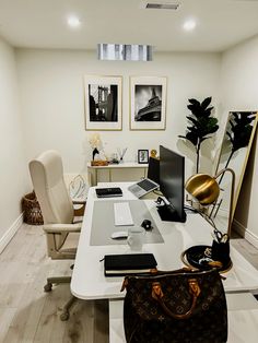 an office with a desk, chair, computer and other items on the table in front of it