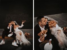 a man and woman sitting on the ground with pizza in their hands while they are kissing