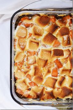 a casserole dish is shown in a glass baking pan on a white tablecloth