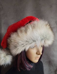 SIZING  Average will fit 22 to 23 inch heads. The large will fit 24 inch heads, the XL and 3 Footer will fit up to a 25 to 26 inch head. The long hats will fit 22 to 24 inch heads.    These hats are made from a gorgeous, thick bright red fur. It's short and is nice and soft. The brim is a generously cut faux Canadian fox fur that is nice and wide so it can be cuffed down for added fullness. It has a pretty soft gray undercoat, with a snowy white top coat dusted with darker shades of beige and gr Red Brimmed Winter Hat, Red Santa Hat, Red Fur, Stocking Hat, Marina Blue, Shades Of Beige, Green Sequins, White Faux Fur, White Fur