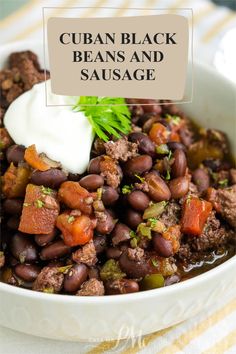 a white bowl filled with beans and sausage