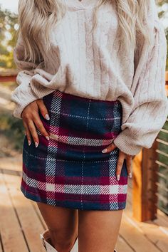 - Bring on plaid season with this adorable mini skirt! Perfect for everything from everyday outings to brunches with friends, this chic piece brings charming energy to your OOTD. - Warm, fully lined material with a plaid print - An elastic waistband - Side zip closure - A flattering silhouette that ends in a straight mini skirt length hemline Denim Trench Coat, Faux Leather Purse, Concert Fashion, Sweater Jumpsuit, Essential Dress, Knee High Leather Boots, Teacher Style, Lifestyle Shop, Plaid Skirts