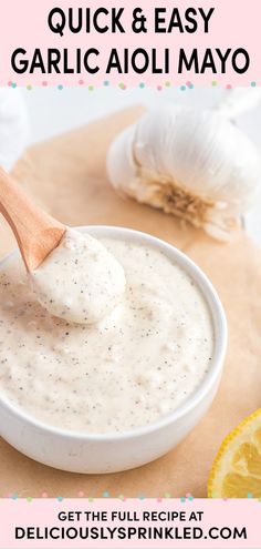 garlic and easy garlic aioli mayo in a bowl with a wooden spoon on top