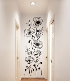 a hallway with flowers painted on the wall and text that reads diy wall mural how to guide for beginners