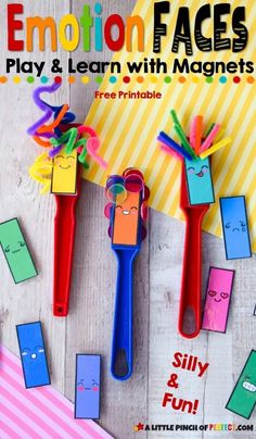 three colorful paper clips with faces on them and the title emotion faces play & learn with magnets