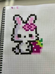 a notebook with an image of a cat in the shape of a bunny on it