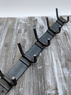 a metal object sitting on top of a wooden table