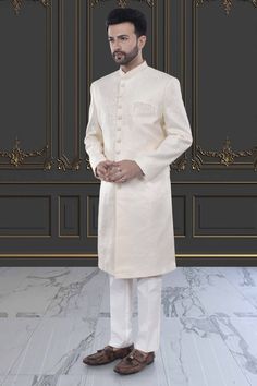 This Mens Sherwani is crafted in brocade, providing a luxurious and elegant touch. The intricate design and high-quality material make it perfect for special occasions and cultural events. Experience high-end fashion and traditional style with our Mens Sherwani - M42-S132. White Sherwani, Mens Sherwani, Outfit White, Cultural Events, High End Fashion, Intricate Design, Traditional Style, Make It, Mens Outfits