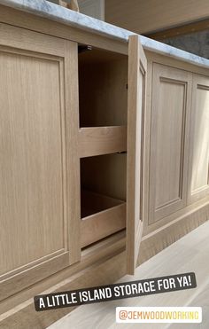 a kitchen with wooden cabinets and marble counter tops