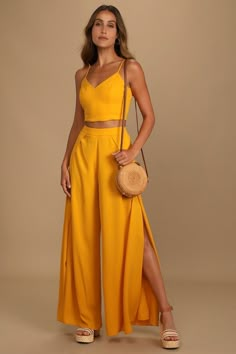 Head to the VIP in the Lulus Out Tonight Mustard Yellow Two-Piece Jumpsuit! Crepe woven fabric shapes this sleek and sexy set that includes a princess-seamed crop top with a V-neckline, and lace-up back. Matching high-waisted trousers have wide, tulip pant legs and a hidden back zipper. Fit: This garment fits true to size. Length: Floor length. Size medium Inseam: 31.50 Front Rise: 11.75 Bust: Great for any cup size. Waist: Fitted - very fitted at natural waist. Hip: Not Fitted - room for hips. Tequila Sunrise Outfit, Guest Ideas, Yellow Two Piece, Yellow Jumpsuit, Two Piece Jumpsuit, Tequila Sunrise, Supper Club, Guest Outfit, Fashion Mode