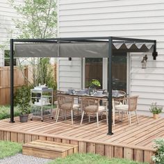 an outdoor dining area with wooden decking and patio furniture