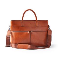 Impeccably crafted from high quality leather, the Graham Leather Collection is filled with classic styles for work and travel. An oversized work tote with the classic style of a briefcase, this versatile bag is thoughtfully designed with multiple compartments and pockets to keep everything organized. With a top carry handle, an adjustable shoulder strap and a trolley pass that attaches to your luggage handle, this bag is built for easy travel. Add a classic foil monogram for a personal touch. Beis Luggage, Camo Handbags, Everyday Leather Bag, Office Bags For Men, Leather Business Bag, Leather Computer Bag, Leather Briefcase Bag, Briefcase Bag, Straw Beach Bag