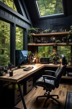 a home office with large windows and lots of plants