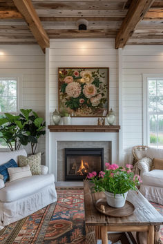 a living room filled with furniture and a fire place next to a painting on the wall