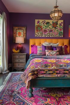 a bedroom with purple walls and colorful bedding