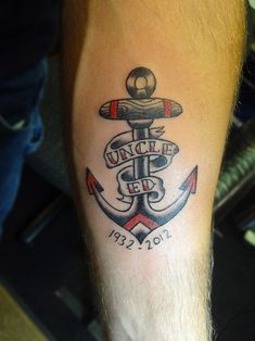 a man with a tattoo on his arm has an anchor and the words, victory