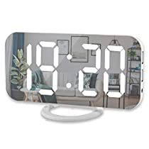 an electronic clock with multiple faces on it's face and the time is 11 00