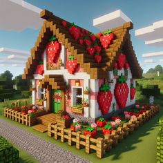 a small house with strawberries on the roof