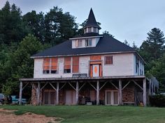 an old house with a steeple on the roof