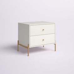 a white cabinet with two drawers on one side and a wooden leg in the other