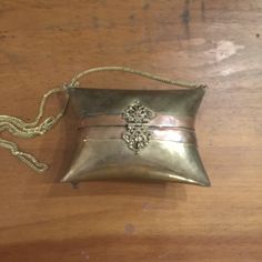 "Vintage brass purse. This is very unique,I love the pillow style. Perfect for a boho decor or fashion! I believe it may be from India.great for a little international flair! It is very ornate and very intricate workmanship. Lined with blue velvet. All solid brass. Size ---6\" x 4\" x 2.5\"" Vintage Gold Bag For Festivals, Vintage Gold Bags For Festivals, Handmade Gold Bags For Festivals, Vintage Engraved Bags As Gifts, Gold Bohemian Clutch Bag, Vintage Handmade Gold Coin Purse, Vintage Bags For Festivals And Gifts, Vintage Gold Clutch For Everyday Use, Handmade Vintage Gold Coin Purse