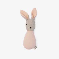 a small stuffed animal that looks like a bunny's head is hanging on the wall