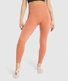 Gymshark Studio Leggings - Orange | Gymshark Casual Seamless Leggings With 4-way Stretch, Stretch Seamless Leggings, Stretch Seamless Leggings Made Of Elastane, High Stretch Seamless Leggings, Athleisure High Stretch Seamless Bottoms, Stretch Seamless Leggings For Pilates, Stretch Seamless Tights For Yoga, Breathable Micro-elastic Seamless Leggings, Functional Seamless Micro-elastic Leggings