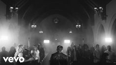 black and white photo of people in a church