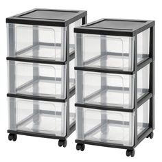 three clear storage containers stacked on top of each other with black lids and wheels,