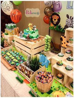 an animal themed birthday party with cupcakes and desserts