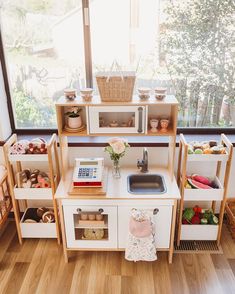 a play kitchen with lots of toys in it