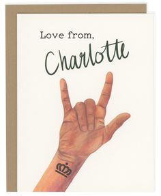 a card with the words love from charlotte written on it and a hand in the shape of a peace sign