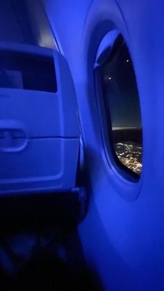 the view from inside an airplane window at night