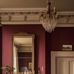 a living room filled with furniture and a chandelier