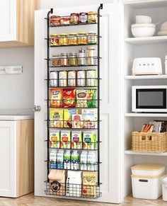 a pantry door is open to reveal the food in it's storage compartment and shelves