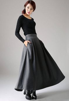 "Fluidity and elegance from this chic winter skirt. Team the wool skirt with a chunky sweater, winter boots and an over sized handbag and you're good to go, no matter what the weather throws at you! You'll really be able to turn on the charm with this versatile long pleated skirt. The gray color means that you'll match it with literally everything you own. This a line skirt will soon become a staple in your winter wardrobe collection. DETAIL * 30% wool, 30% fiber, 40% polyester * polyester linin Winter Wool Skirt, Long Skirt Winter, Long Wool Skirt, Maxi Skirt Winter, Grey Pleated Skirt, Plaid Wool Skirt, Skirt Winter, Fit And Flare Skirt, Gray Winter