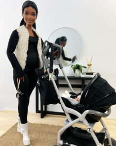 a doll is standing next to a stroller