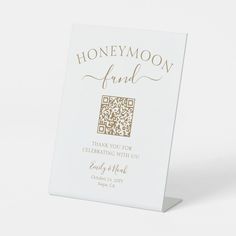 a white card with gold foil on it that says honeymoon fund