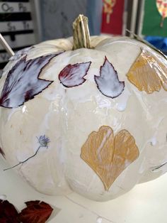 a white pumpkin sitting on top of a table