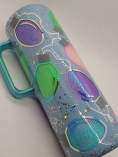 a blue and green case with some glitter on it