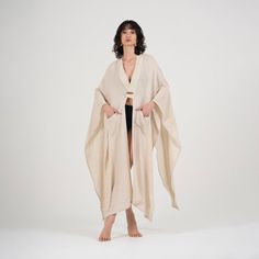 Size: One Size Fits Most. Step up your beach attire with our Elaine Beige Linen Kimono & Beach Cover-Up. Crafted from linen, it's perfect for relaxing or taking a stroll along the shore. The versatile beige color complements any outfit, while the loose fit accommodates most body types. Featuring a stylish V-neck design, long sleeves, and pockets on each side, this kimono offers both style and practicality. With its easy button closure, it's a breeze to slip on over your swimsuit for quick coverage. Whether you're lounging by the water or exploring the coastline, our Elaine Beige Linen Kimono & Beach Cover-Up is the perfect choice for effortless beach chic. Linen Cover-up For Spring Vacation, Bohemian Linen Beach Cover-up, Bohemian Linen Cover-up For Vacation, Bohemian Linen Cover-up For Spring, Spring Bohemian Linen Cover-up, Linen Beach Cover-up, Linen Beach Cover-up For Beach Season, Summer Linen Beach Cover-up, Summer Linen Cover-up For Beach