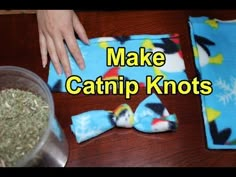 someone is making catnip knots on the table with some stuff in front of them